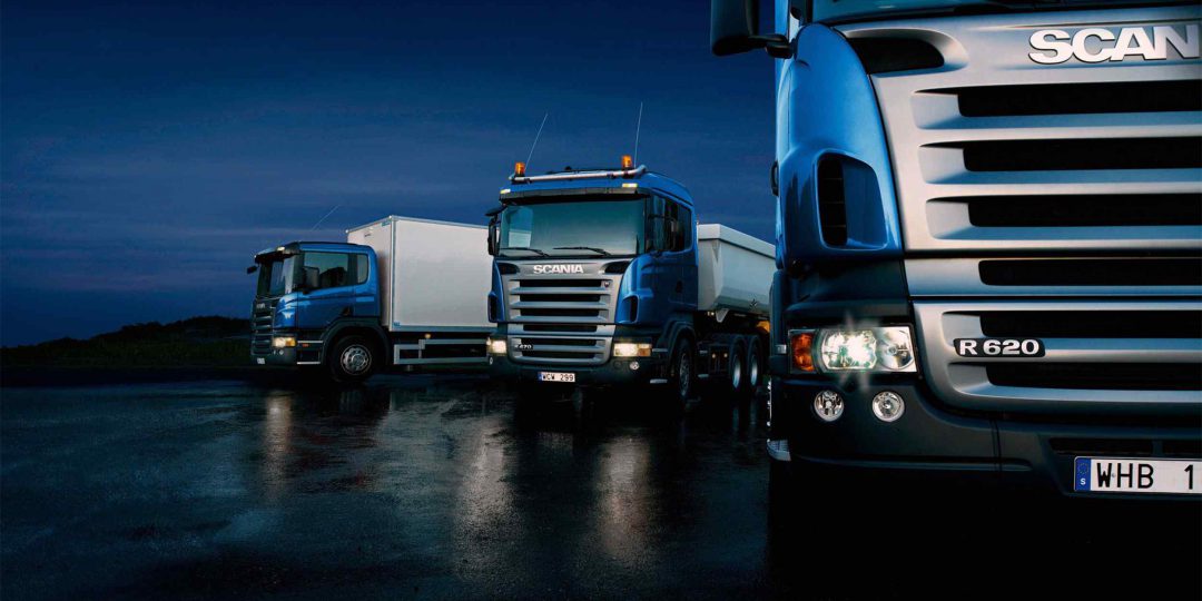Three-trucks-on-blue-background-1080x540.jpg